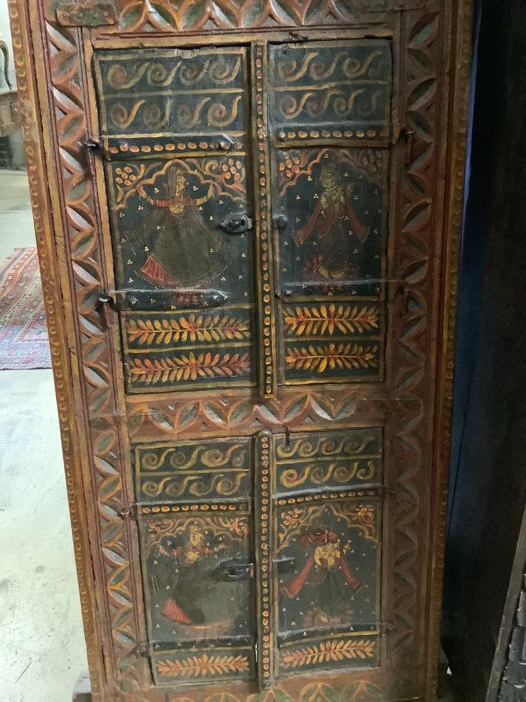 An Indian carved gilt painted panel, width 60cm height 170cm